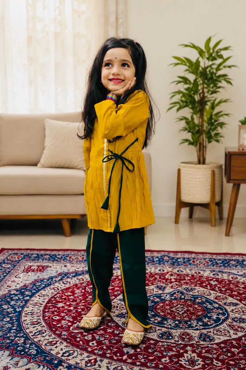 Ashvika posing indoors in a festive outfit